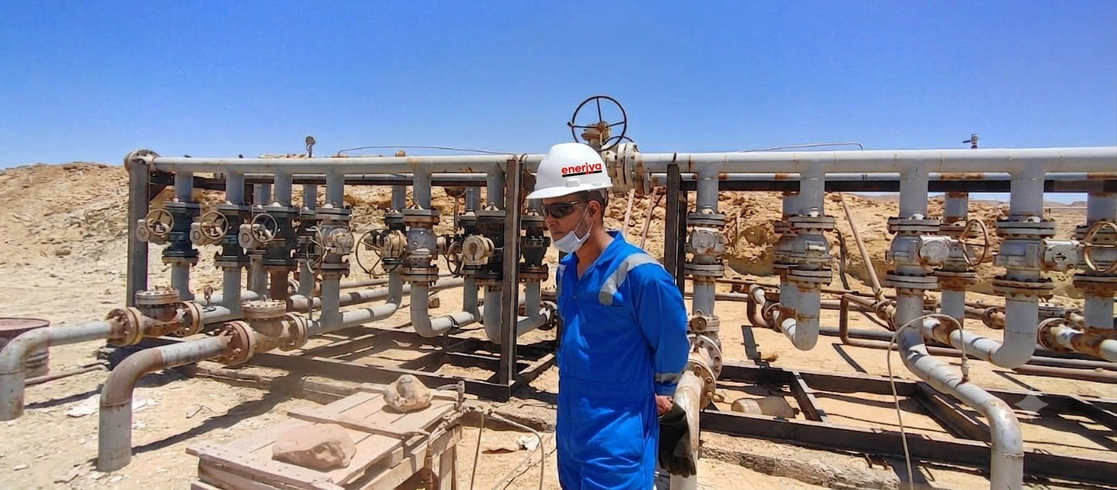 Enerjya crew operating a wellhead in the field